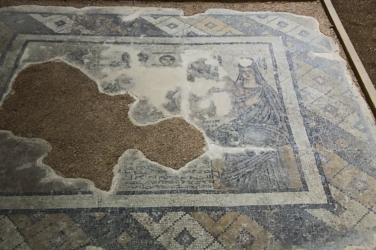 A floor mosaic shows a reclining man and family members in patterned clothing.