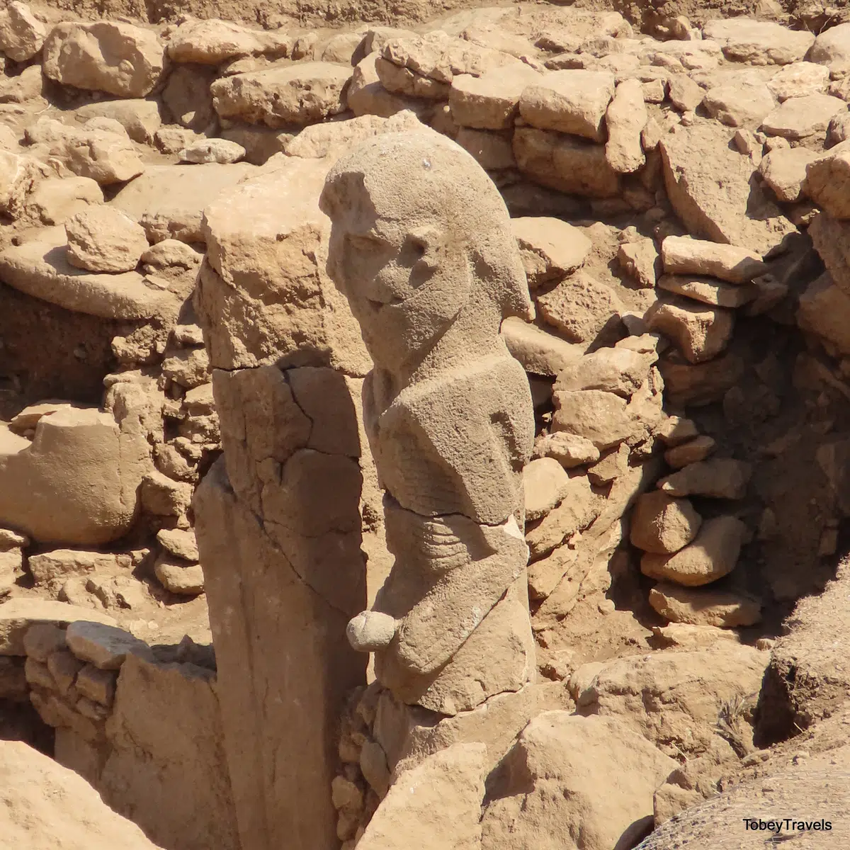 A porthole stone and pillar-like sculpture at Karahan Tepe.